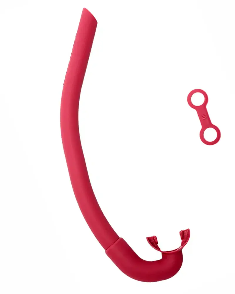 The AGULHAS CEPEDIANUS freediving snorkel in Coralline Pink, made from a single, flexible piece of silicone, with a classic J-tube design.